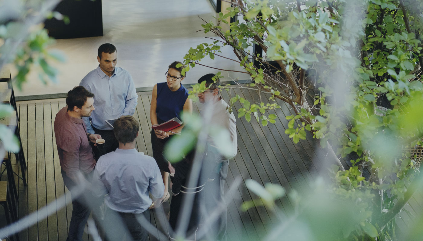 Group of business people standing in a circle